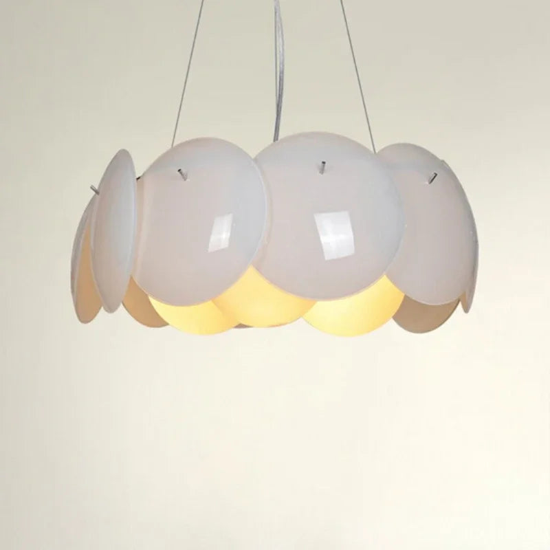 Three glass globes over a dining table