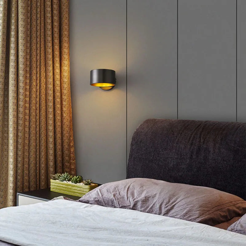 Mini brass wall light in a hallway