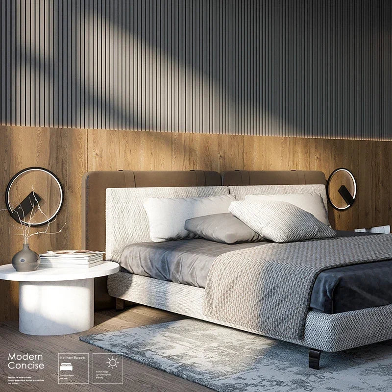 Round aluminum sconce in a hall