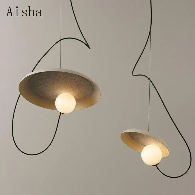 Orange iron pendant over a table